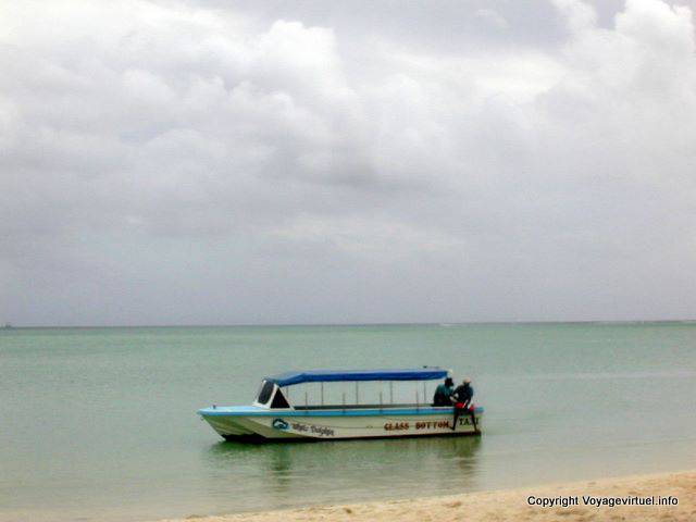 Boat on the beach of Le Morne, Mauritius.