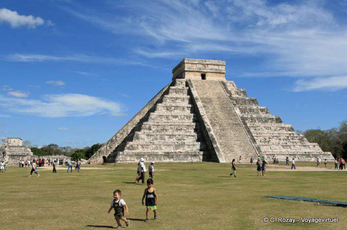 Children on the grass, Pyramid of Kukulcan, Chichen Itza - Mexico
