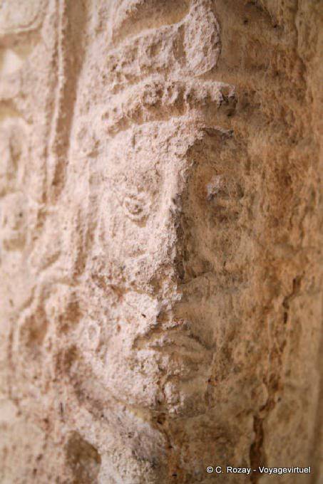 Face carved on a stele, close up view, Edzná - Mexico