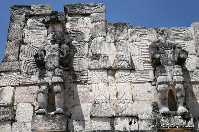 Statues in the wall sculptures Jaguar, Kabah - Mexico