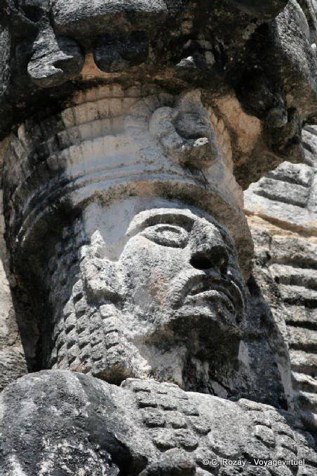 Focus on the face of the statue, east side, Jaguar sculpture, Kabah - Mexico