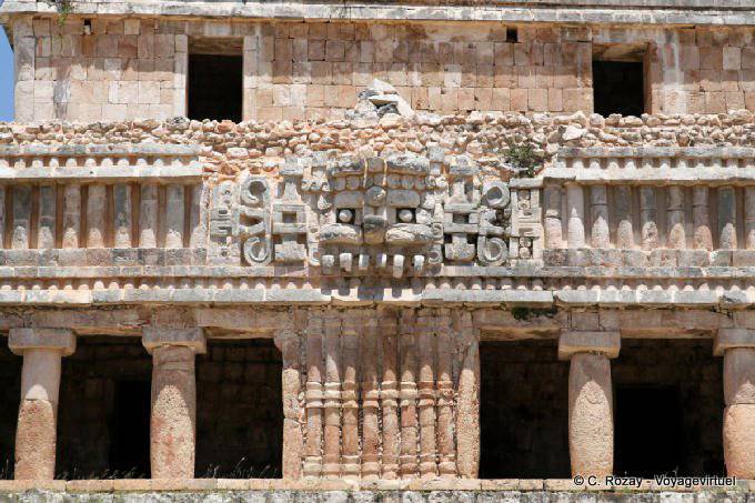Columns supporting the mask of God Chaak, North Palace, Sayil - Mexico