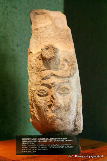 Snake whose jaws grow on a human face, sculpture of the Queen of Uxmal - Mexico
