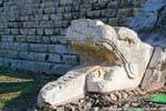Snake head at the foot of the Pyramid of Kukulcan, Chichen Itza, Mexico.