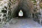 Mayan arch tunnel leading down to a chamber in the pyramid Coba, Mexico.