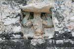 Focus on an Atlas supporting the temple Nohoch Mul, Coba, Mexico.