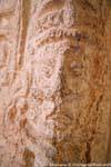Face carved on a stele, close up view, Edzná, Mexico.
