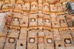 Focus on the masks of Chac, Palace of the Masks, Kabah, Mexico.