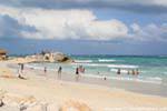 Bathers on the beach of Tulum, Mexico.
