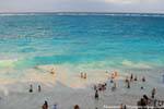 Swimming on the beach of the Maya site Tulum, Mexico.