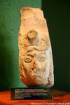 Snake whose jaws grow on a human face, sculpture of the Queen of Uxmal, Mexico.
