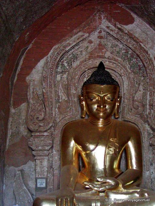 Golden Buddha in front of a relief, Ancient Bagan - Myanmar (Burma)