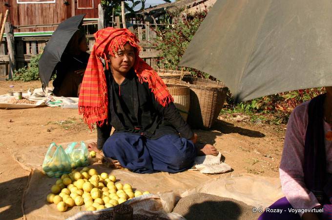 Pa-O woman selling apples at the market, Inle Lake - Myanmar (Burma)