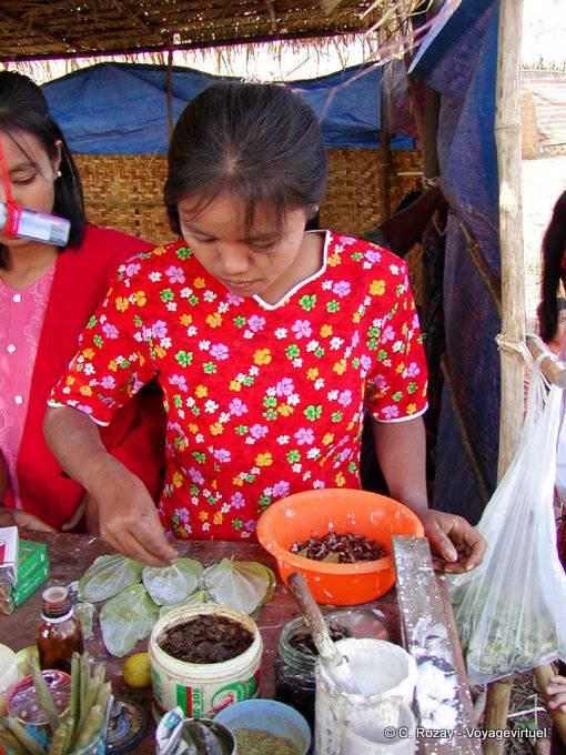 The flowery dress of the young merchant betel Inle Lake - Myanmar (Burma)
