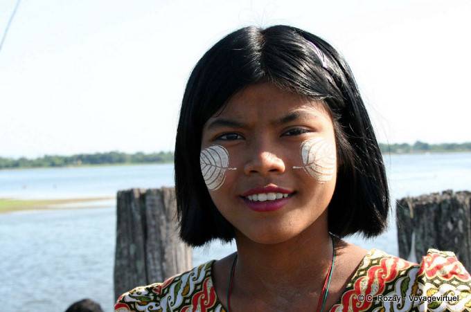 The girl in sheet form thanaka on U Bein Bridge, Mandalay - Myanmar (Burma)