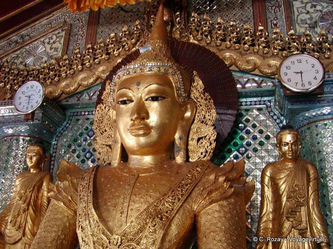 The head of the Buddha and clocks, 9:30 AM, Shwedagon, Yangon - Myanmar (Burma)