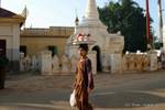 Burmese with apple tray on her head, Bagan, Burma.