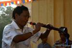 Musician blowing his instrument, Bagan, Burma.