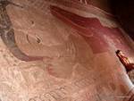 Large mural of Buddha lying on a wall in the temple of Sulamani, Bagan, Burma.