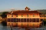 Sunset colors in a house on stilts, Inle Lake, Burma.