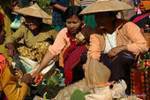 Discussion at the market Yaeo Ma, Inle Lake, Burma.