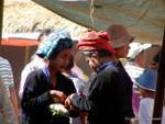 Discreet transaction between women Paos, Inle Lake, Burma.