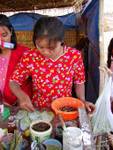 The flowery dress of the young merchant betel Inle Lake, Burma.