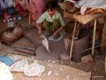 Preparing patties on sand, market Khaung Daing, Inle Lake, Burma.