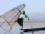 Throwing the net, fishing on Lake Inle, Burma.