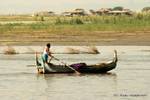 Passing boat rowing, Ayerwayadi river, Mandalay, Burma.