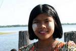 The girl in sheet form thanaka on U Bein Bridge, Mandalay, Burma.