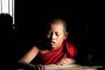 Little monk in the monastery learning, Bagaya Kyaung, Inwa, Mandalay, Burma.