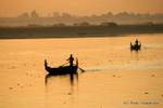 Boats at dawn on Ayeyarwady, Mandalay, Burma.