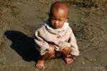 Very young Burmese on the edge of the river, Mandalay, Burma.