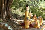 Set of praying statues of the Buddha in Mudra around the start of the wheel of Buddhist law or preaching, Mount Popa, Burma.