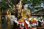 Prayer around the seated Buddha in Dharmachakra Mudra-Popa mount, Burma.