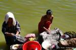 Laundry in the pond, Pindaya, Burma.