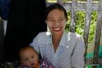 The smile of the Burmese thanaka bearing and child, Pindaya, Burma.