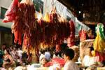 Sausages hanging to the market, Rangoon, Burma.