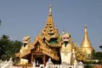 Two chintheis (carved lions) at the entrance of the Shwedagon Pagoda, Rangoon, Burma.
