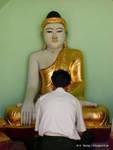 Praying man, Sule Pagoda, Yangon, Burma.