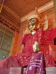 Buddha in red dress in the pagoda on the corner of Old Yay gyár Tawya and Tar Shay St., Rangoon, Burma.