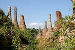 Stupas group in vegetation, Sagar, Burma.