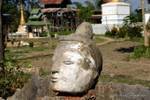 Severed head isolated stone on the site of Sankar, Burma.