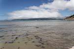 Low clouds over the mountains to the south, Tokomaru Bay, East Cape, New Zealand.