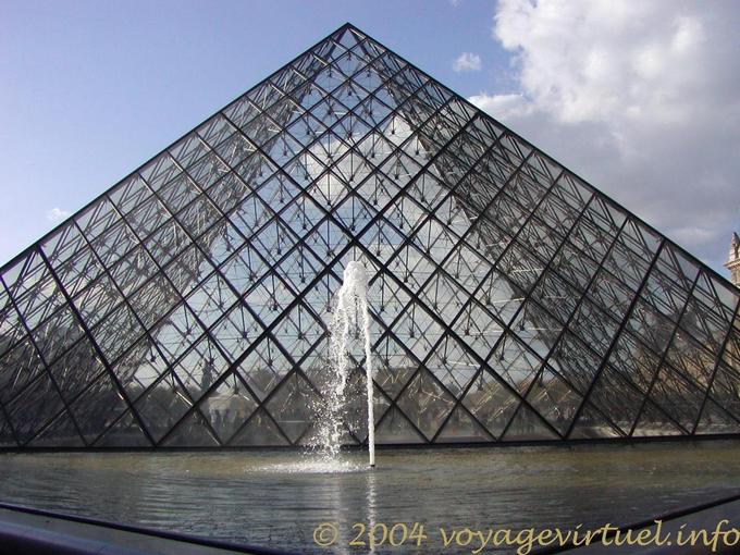 The pyramid and the water jet, Louvre Paris, France