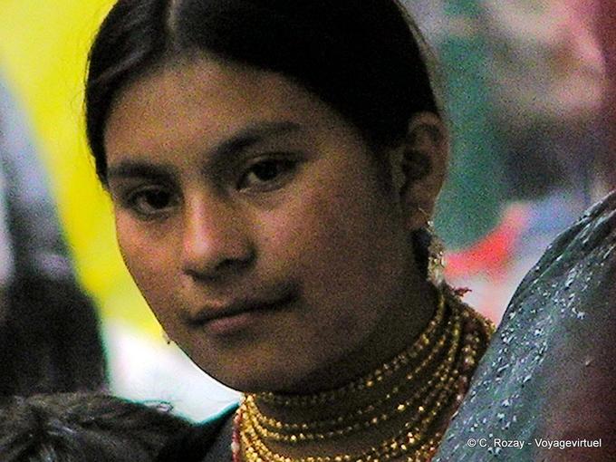 Indian wearing a necklace with gold beads (wallka) Otavalo -Ecuador