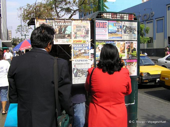 Reading newspapers on display, Lima -Peru