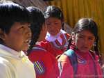 Aymara child portrait in uniform for school, Lake Titicaca, Peru.