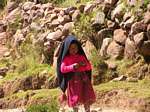 Jasmine, small taquileños in traditional costume, Isla Taquile, Titicaca, Peru.